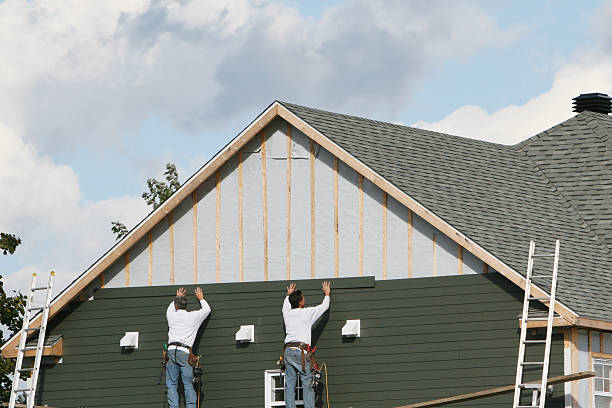 Professional Siding Contractor technician working in Milton, MA